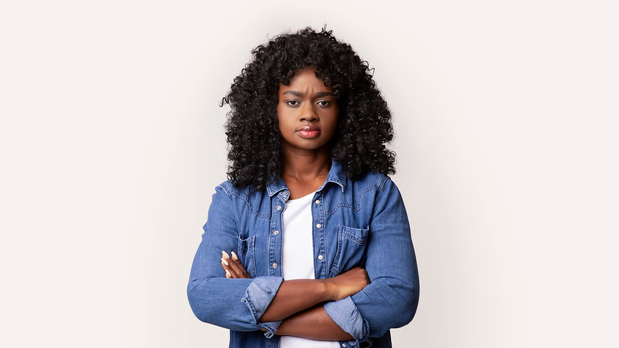 A woman standing with her arms crossed