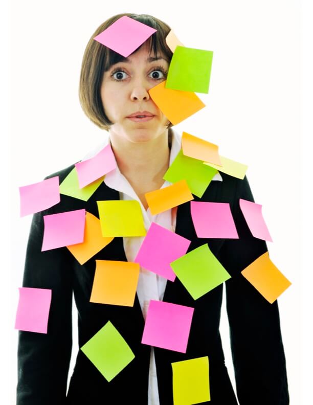 A woman covered in colorful sticky notes